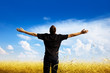 young man rest on wheat field