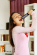 happy caucasian teenage girl singing