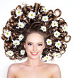 Smiling woman with flowers in hair