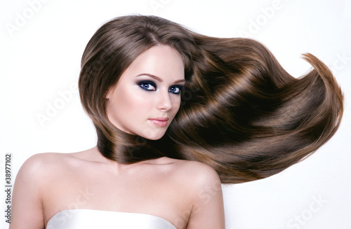 Photo: Beautiful young woman with long hair Beautiful young woman with long hair