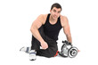 young man posing with dumbbells