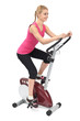 Photo: young woman doing indoor biking exercise young woman doing indoor biking exercise