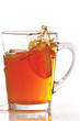 Photo: Cup of ice tea and lemon with splash on a white background Cup of ice tea and lemon with splash on a white background