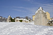 The rock ruins and the snow under the blue sky