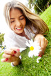 Woman holding a daisy