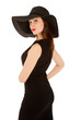 Beautiful woman with red lips  in little black dress and hat