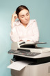 Businesswoman with copier