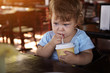 Sad child drinking