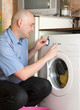 men loading the washing machine