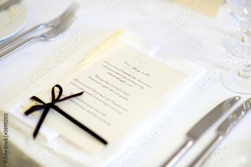 Photo: Table set with menu for an event party or wedding Table set with menu for an event party or wedding