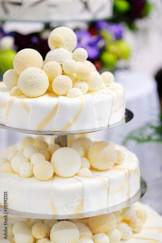 Photo: Fancy delicious white and yellow wedding cake Fancy delicious white and yellow wedding cake