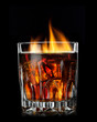 Foto: cola with cognac and fire in glass on black cola with cognac and fire in glass on black