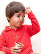 Photo: bambino che mangia cioccolato con il cucchiaino bambino che mangia cioccolato con il cucchiaino
