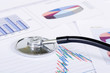 Stethoscope on a stock chart - market analysis