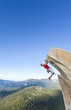 Dangling from the edge.