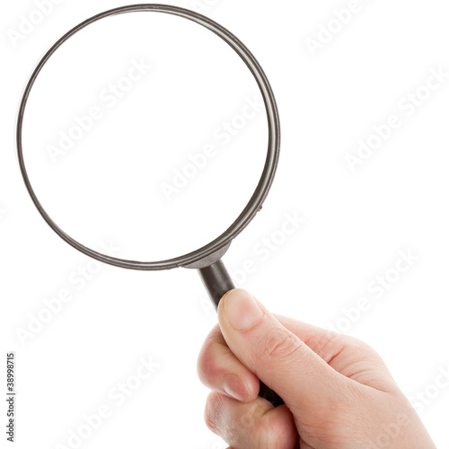 Photo: Hand holding magnifying glass Hand holding magnifying glass