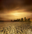 pollution theme with cracked land and the cityscape