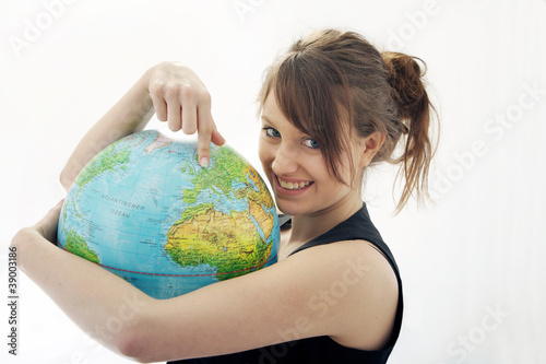 Photo: Junge Frau mit Globus Junge Frau mit Globus