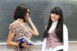 Two students near the blackboard Two students near the blackboard