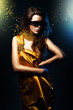 woman in yellow dress and black mask with broken jewelry