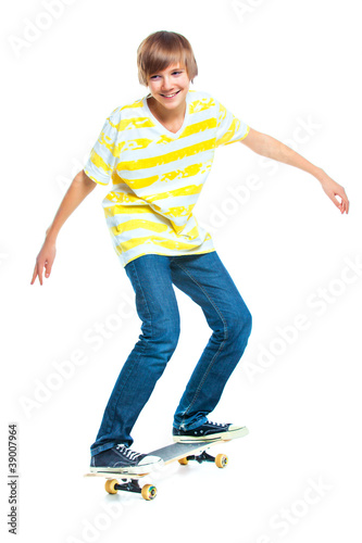 Photo: blond boy on standing on skateboard blond boy on standing on skateboard