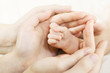 Baby hand into parents hands. Family concept Baby hand into parents hands. Family concept