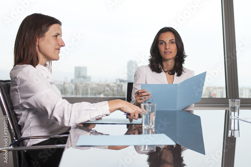 Photo: Recruiter checking the CV during job interview Recruiter checking the CV during job interview