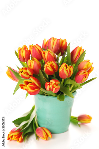 Photo: Beautiful bouquet of tulips in vase on white background. Beautiful bouquet of tulips in vase on white background.