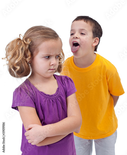 Photo: Upset little girl bullied by older boy Upset little girl bullied by older boy