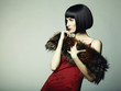 Fashion portrait of a young beautiful dark-haired woman