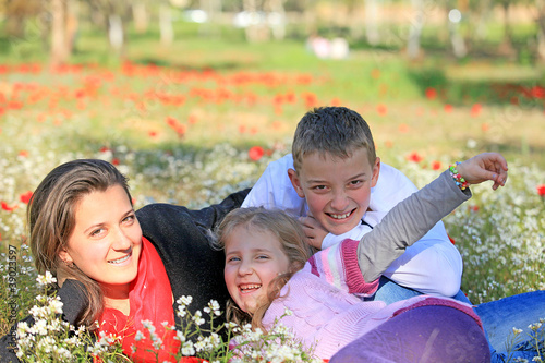 Photo: Mom with son and daughter in the park fooled Mom with son and daughter in the park fooled