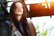 Portrait of the young beautiful smiling woman outdoors