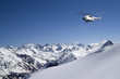 Photo: Helicopter in snowy mountains Helicopter in snowy mountains