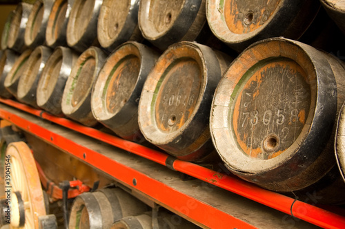 Photo: Row of wooden beer barrels Row of wooden beer barrels