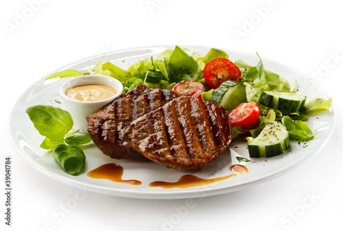 Photo: Grilled steaks and vegetables Grilled steaks and vegetables