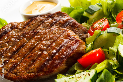Photo: Grilled steaks and vegetables Grilled steaks and vegetables