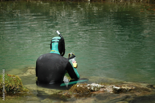 Photo: A cave diver emerges from a spring A cave diver emerges from a spring
