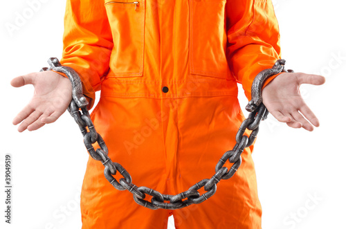 Photo: Criminal in orange robe in prison Criminal in orange robe in prison