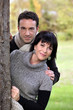 Photo : Couple walking in a park Couple walking in a park