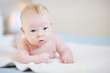 Adorable baby girl on a white blanket Adorable baby girl on a white blanket