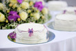 Delicious white and purple decorated wedding cake