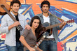 Musical group stood by wall