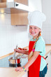 girl cooking in modern kitchen