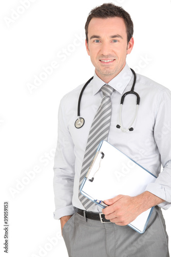 Photo: Male doctor holding patients results Male doctor holding patients results