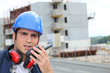 craftsman talking on a talkie walkie