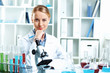 Photo: Young scientist working in laboratory Young scientist working in laboratory