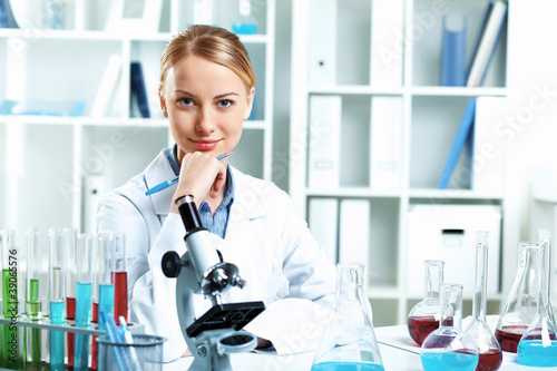 Photo: Young scientist working in laboratory Young scientist working in laboratory