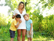Young pregnant mother with two preschooler sons