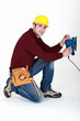Carpenter saving time by using electric sander