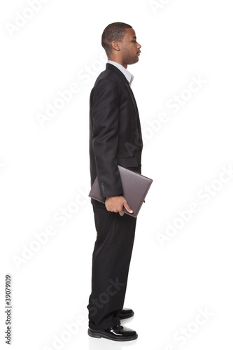 Photo: African American businessman carrying notepad African American businessman carrying notepad